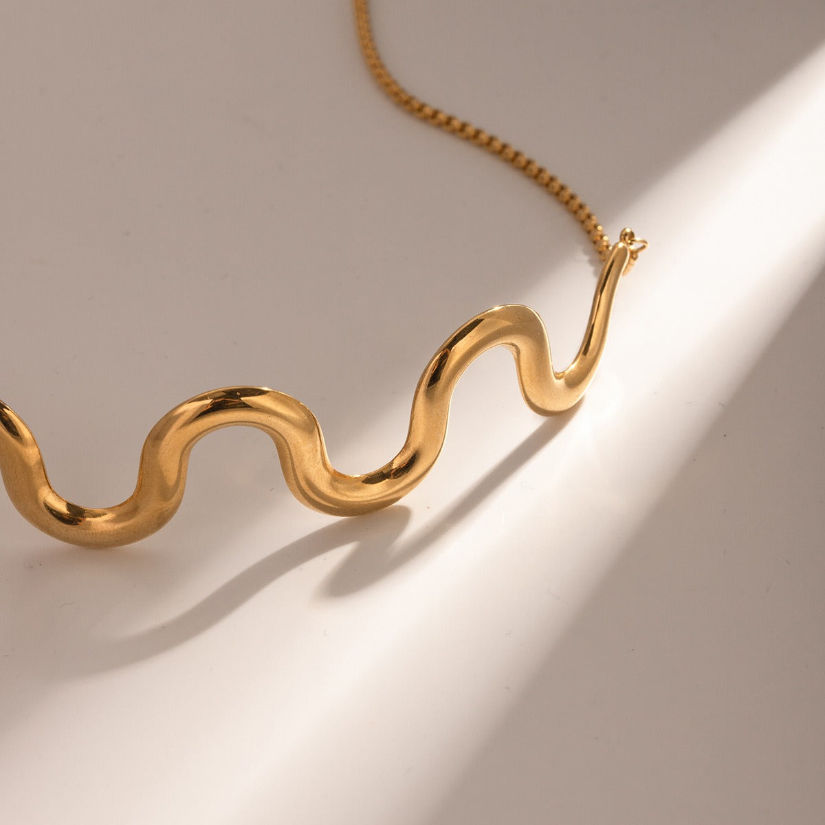 Gold Plated Necklace in Wave Pull