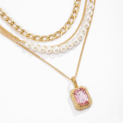 Gold Plated Multi-layered Necklace with Pearls and Pink Gemstone